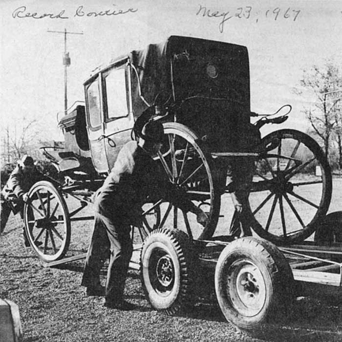 Riddle Coach being loaded onto truck