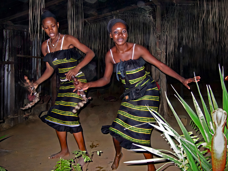 Two dancers with rattles