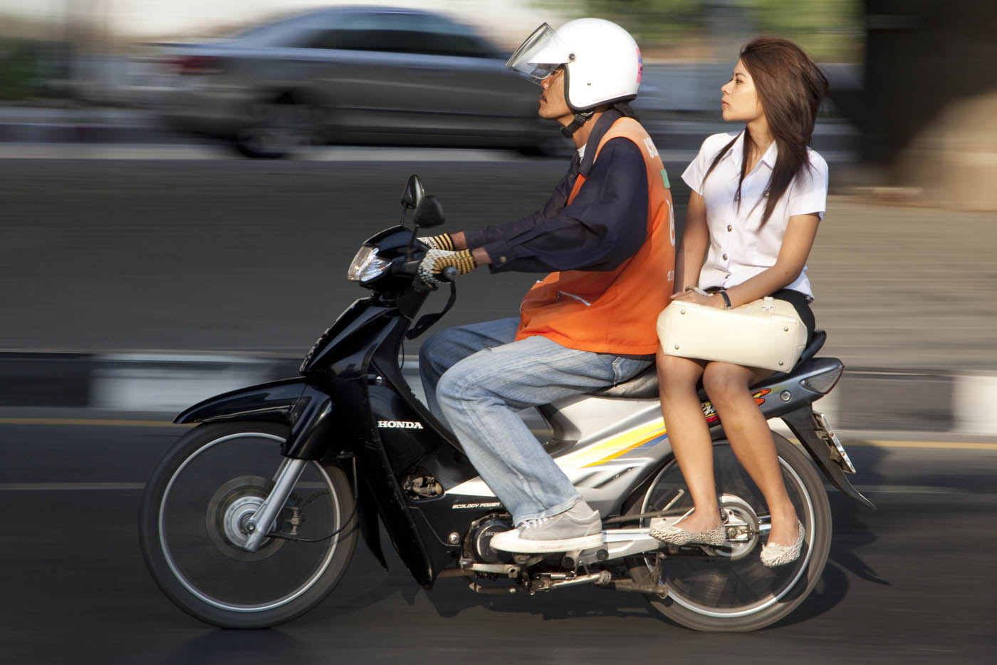school girl  on Bangkok motorcycle taxi