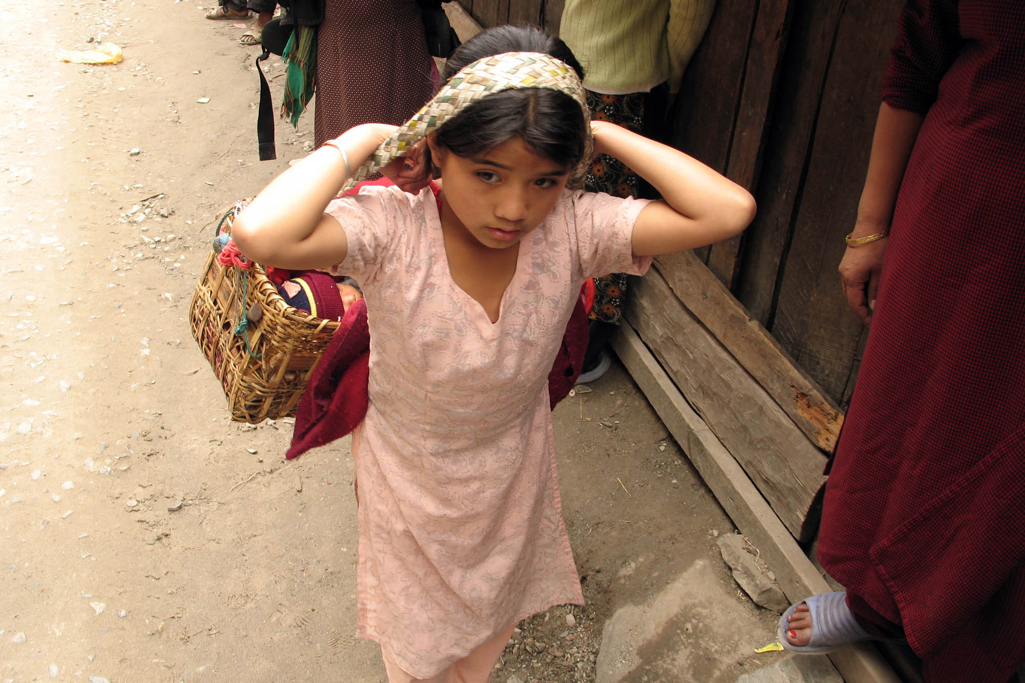 Little Girl Carries Sibling at the Border