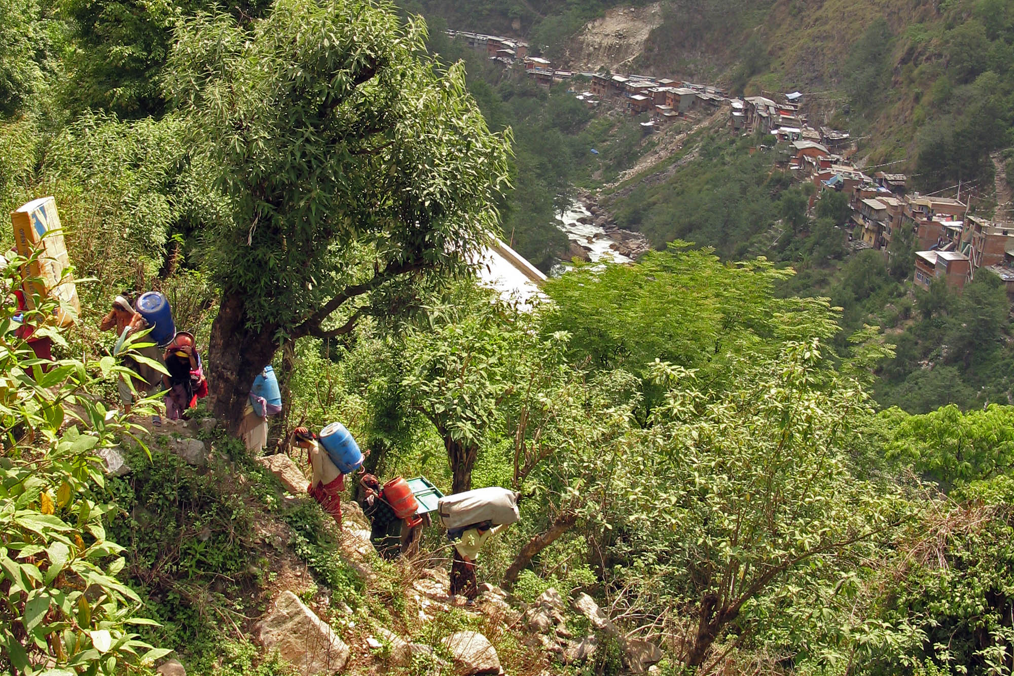 Porters Climb the Hill at the Border