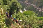 10_porters_climb_up_hill_at_border